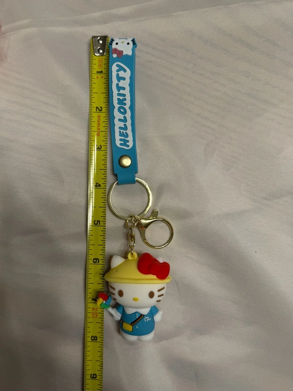 Hello Kitty Blue Outfit with pinwheel. Keychain/ wristlet.